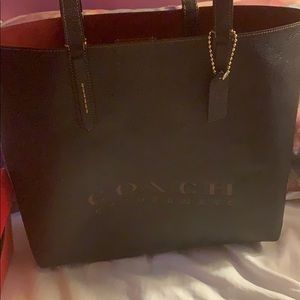 Black coach leather ware tote bag
